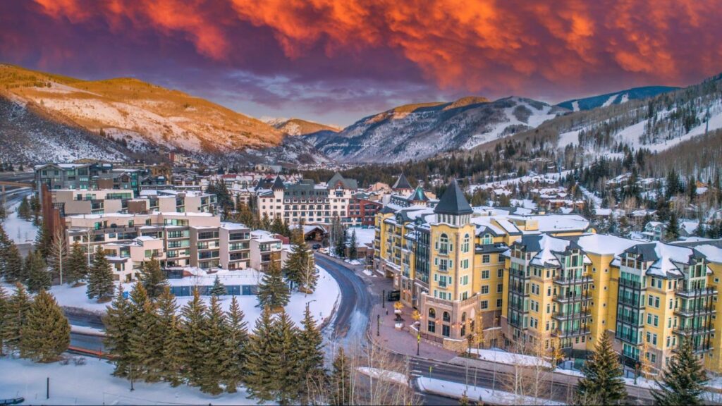 Downtown skyline of a city in Colorado surrounded by mountains